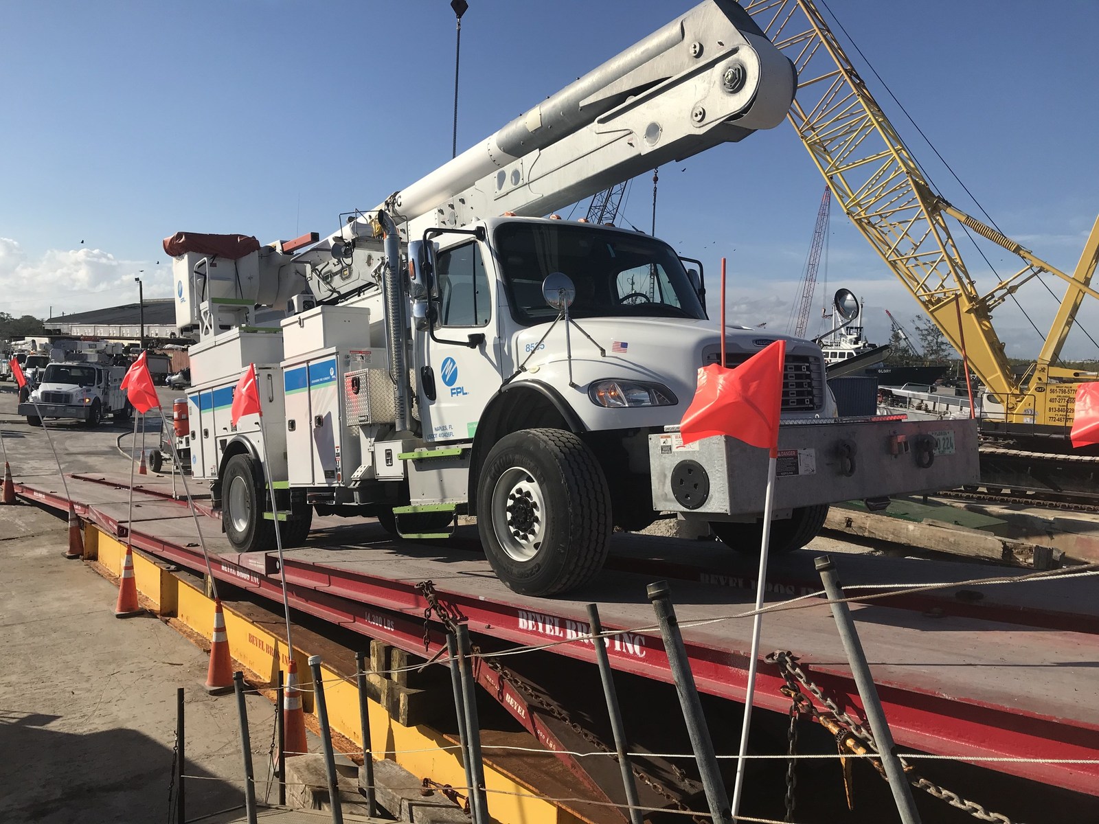 FP&L loading trucks on barges to head to Puerto Rico