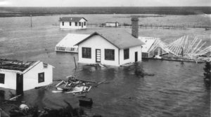 The Belle Glade Everglades experiment station after the hurricane of 1928. Palm Beach Post file photo BELLE GLADE --- An undated photo taken in the aftermath of the 1928 hurricane shows the damage done to a cluster of scientific work stations. Thousands drowned on Sept. 16 that year when hurricane-force winds blew a wall of water from Lake Okeechobee through a makeshift dike. The official death toll is 1,836, but historians and hurricane researchers say it's probably closer to 2,500 or 3,000. ORG XMIT: MER0503211643572784 ORG XMIT: MER0705171719342077